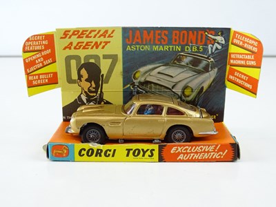 Lot 33 - A CORGI 261 James Bond's Aston Martin in gold...