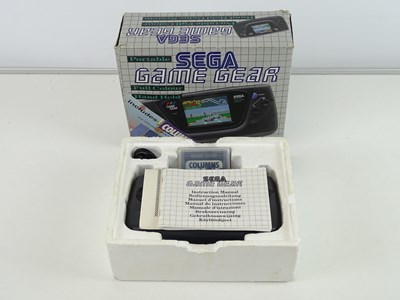 Lot 66 - Portable Sega Game Gear console includes...