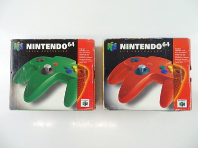 Lot 71 - A pair of Nintendo 64 N64 controllers, one red...