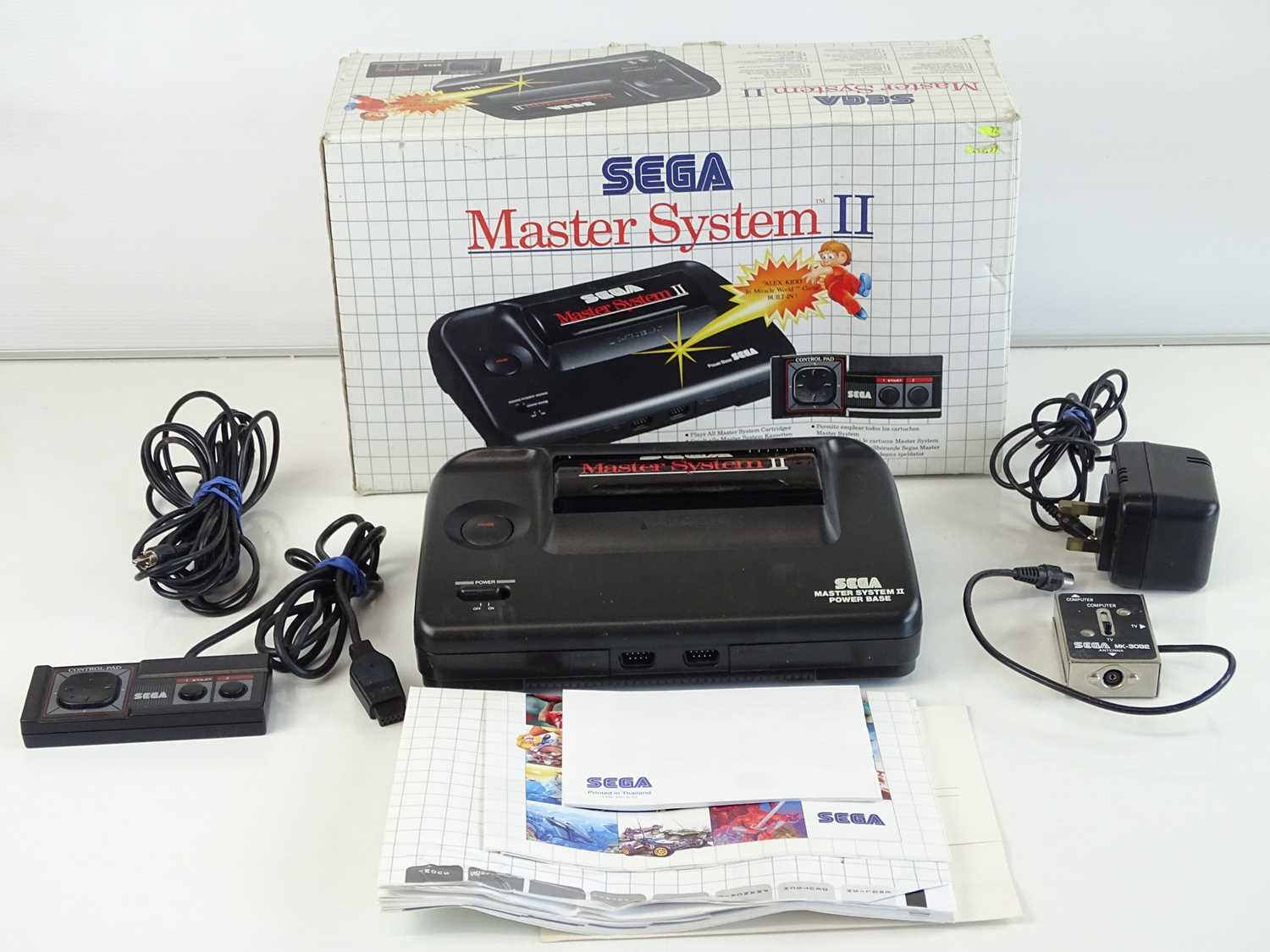 Lot 104 - Sega Master System II video games console with...