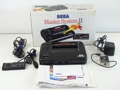 Lot 104 - Sega Master System II video games console with...