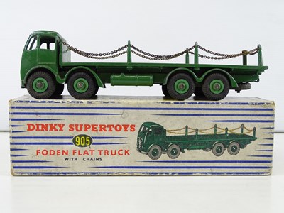 Lot 142 - A DINKY 905 Foden Flat Truck with chains in...
