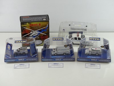 Lot 3 - A group of 1:64 and 1:43 scale police vehicles...
