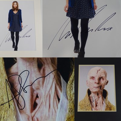 Lot 22 - A pair of signed and mounted photographs...