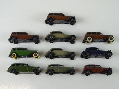 Lot 15 - A group of playworn early DINKY cars including...