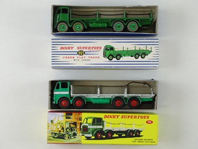 Lot 23 - A pair of DINKY Flat Trucks with chains...