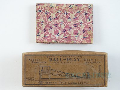 Lot 54 - A pair of early Japanese tinplate toys...