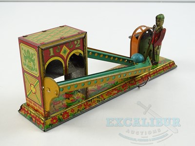 Lot 54 - A pair of early Japanese tinplate toys...