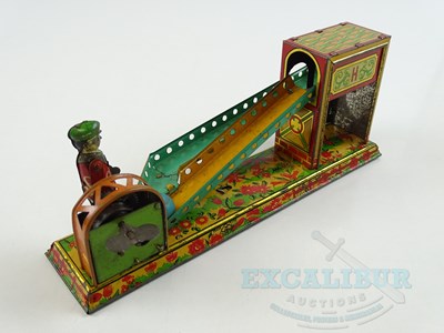 Lot 54 - A pair of early Japanese tinplate toys...