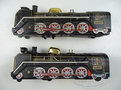 Lot 59 - A pair of MASUDAYA / MODERN TOYS Japanese tin...