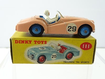Lot 111 - A DINKY 111 Triumph TR2 Sport car in salmon -...