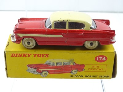 Lot 134 - A DINKY 174 Hudson Hornet, with windows, red...