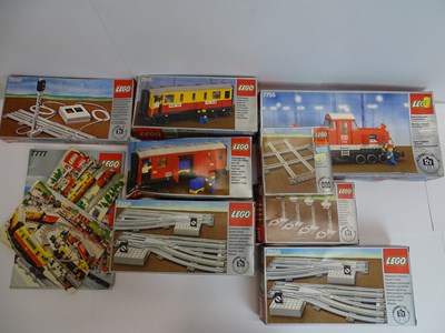 Lot 182 - A group of vintage LEGO train and track kits -...