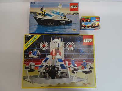 Lot 183 - A small group of vintage 1980s LEGO sets to...