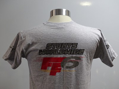 Lot 148 - A group of 6 stunt crew t-shirts and hats for...