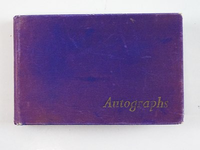Lot 40 - A vintage autograph book containing a number...