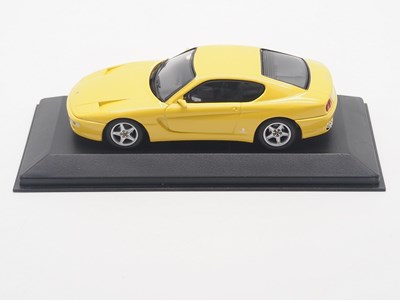 Lot 26 - A group of 1:43 scale models by MINICHAMPS,...
