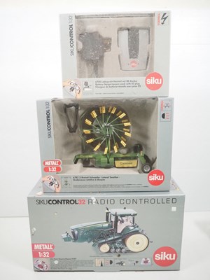 Lot 42 - A group of 1:32 scale SIKU radio controlled...