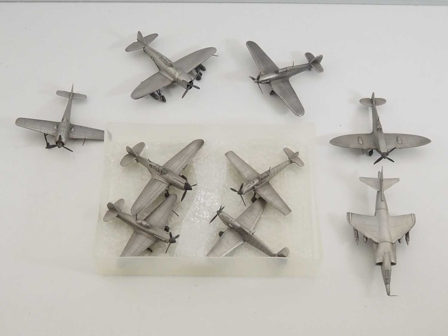 Lot 44 - A group of pewter models of military aircraft...