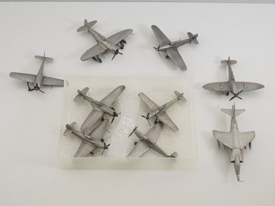 Lot 44 - A group of pewter models of military aircraft...