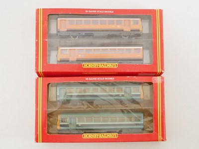 Lot 473 - A pair of HORNBY OO gauge class 142 Pacer...