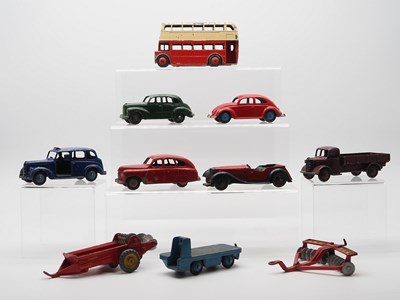 Lot 48 - A group of DINKY Toys to include: a 181 VW...