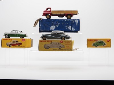 Lot 56 - A group of DINKY Toys plus an empty box,...