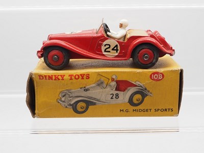 Lot 67 - A DINKY 108 M.G. Midget Sports car, red with...
