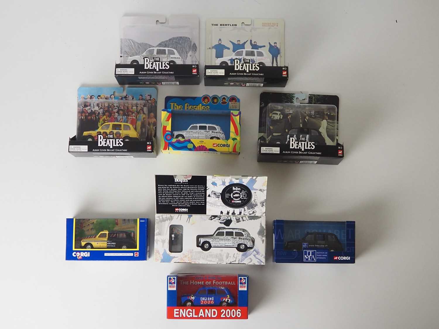 Lot 21 - A group of diecast model Taxis by CORGI - to...