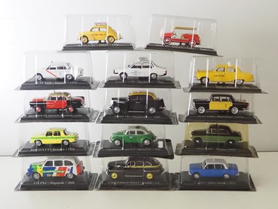 Lot 59 - A group of diecast 1:43 scale model Taxis by...