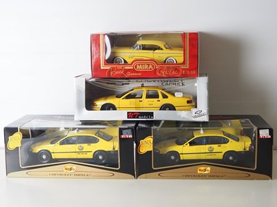 Lot 60 - A group of 1:18 scale diecast model US Taxi...
