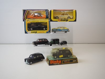 Lot 129 - A group of boxed and unboxed Taxis of various...