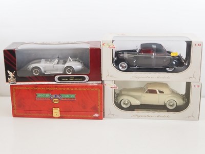 Lot 33 - A group of 1:18 scale diecast cars, comprising...