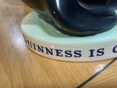 Lot 404 - GUINNESS: Carlton Ware Sealion Lamp with...