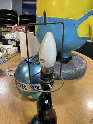 Lot 404 - GUINNESS: Carlton Ware Sealion Lamp with...
