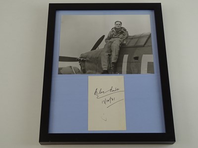 Lot 119 - A framed and glazed display of black and white...