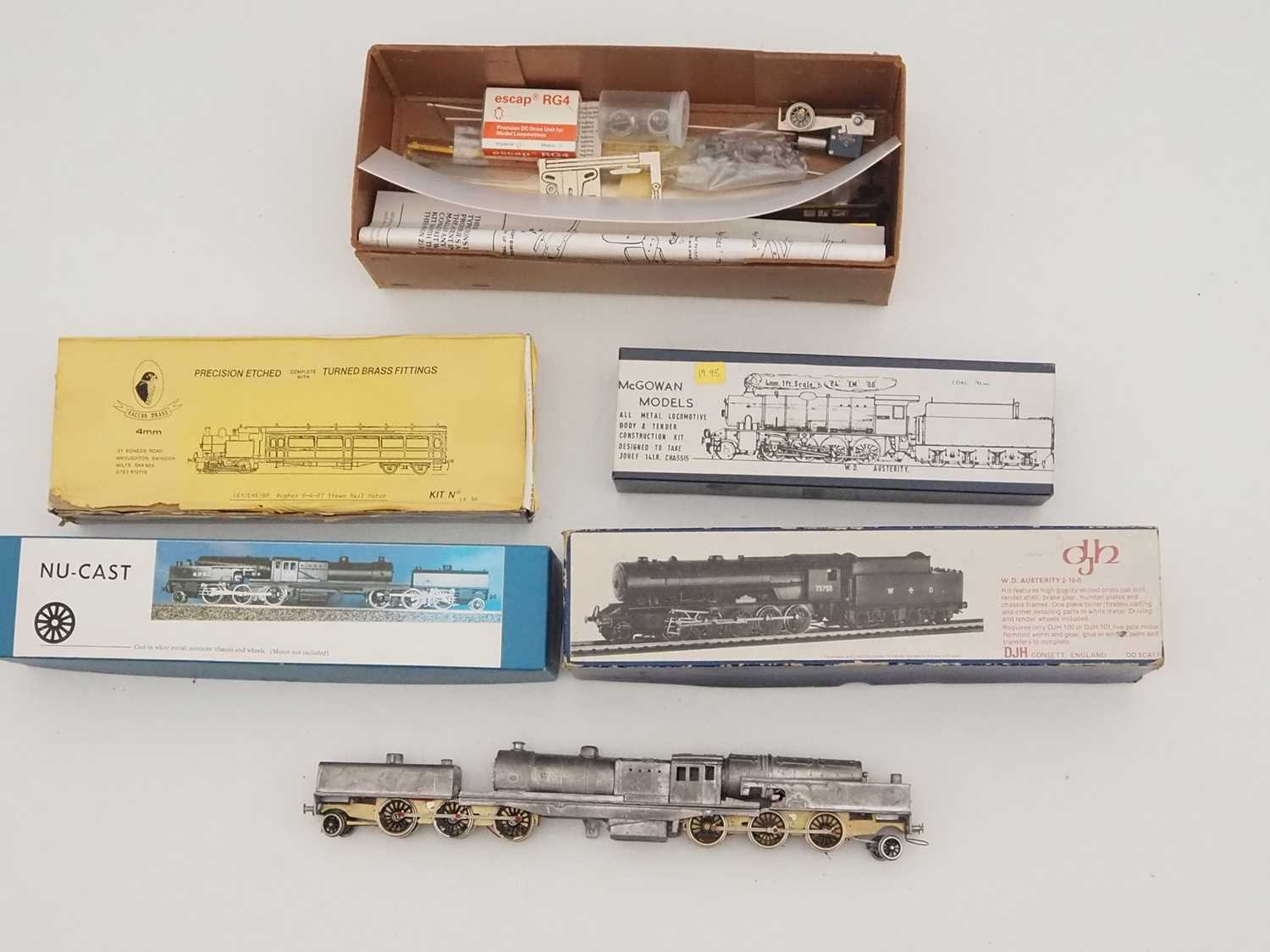 Lot 521 - A group of part built OO gauge brass and white...