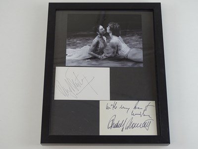Lot 120 - A framed and glazed display of black and white...