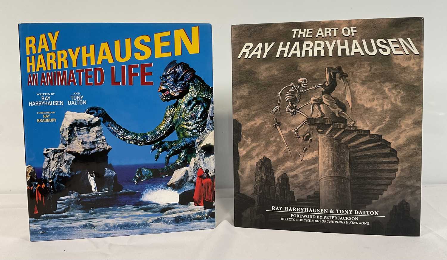 Lot 254 - Two autographed books signed by RAY