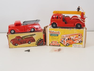 Lot 184 - A pair of vintage plastic fire engines...