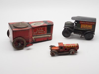 Lot 190 - A group of vintage clockwork tinplate vehicles...