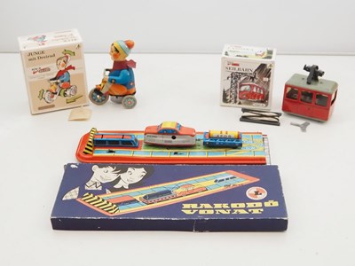 Lot 201 - A group of Eastern European tinplate clockwork...