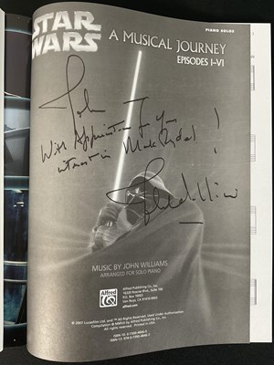 Lot 425 - A group of three JOHN WILLIAMS signed sheet...