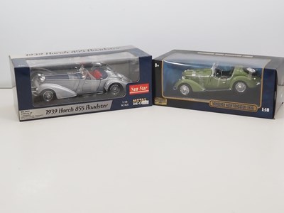 Lot 18 - A pair of 1:18 scale diecast cars by SUNSTAR...
