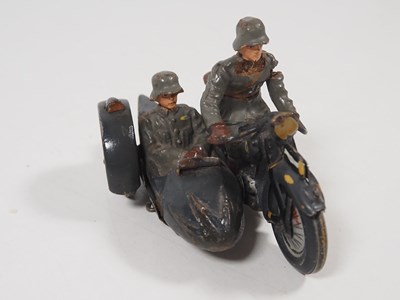 Lot 216 - A group of vintage tinplate and elastolin...