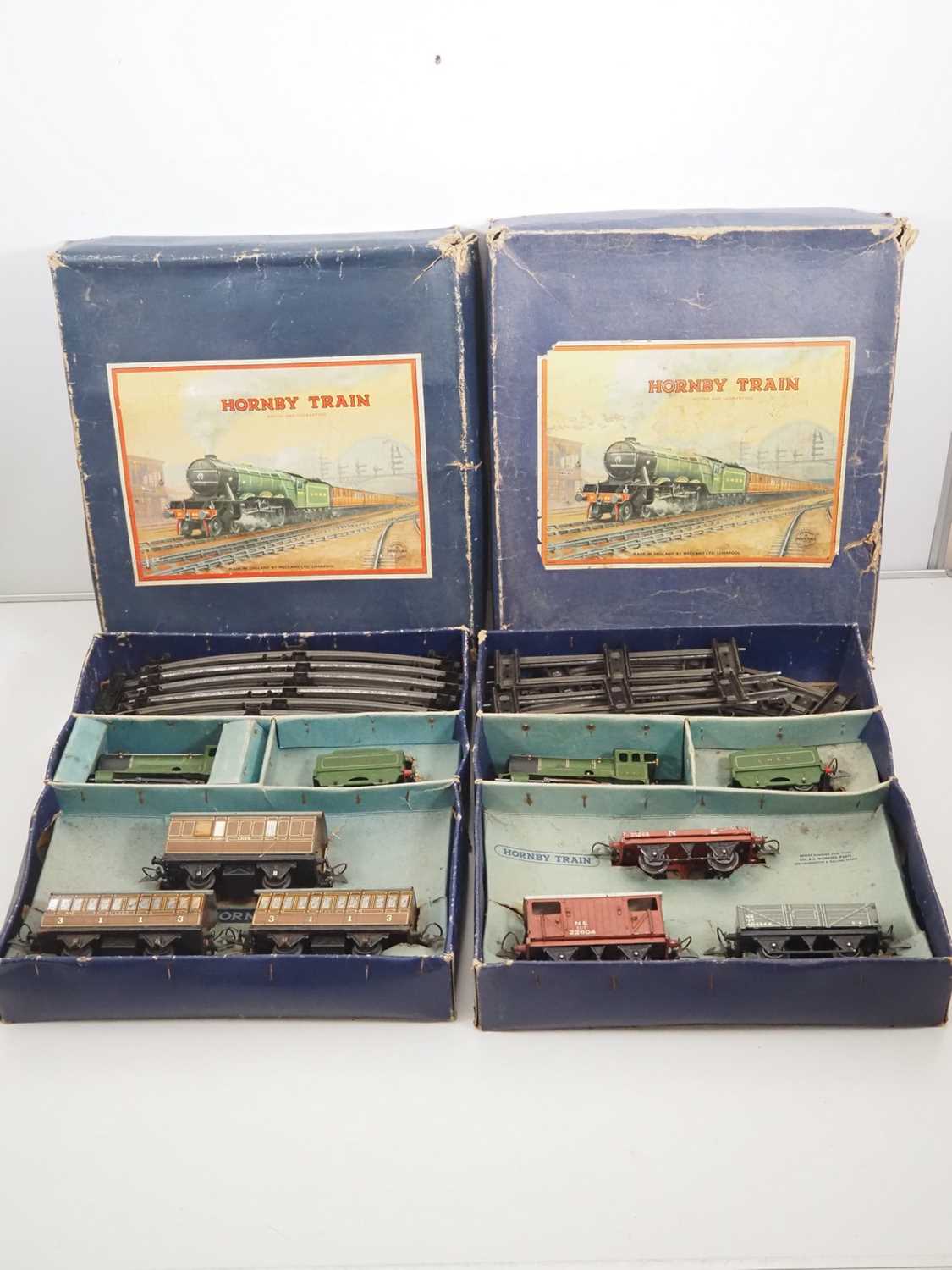 Lot 502 - A pair of HORNBY O gauge clockwork train sets...