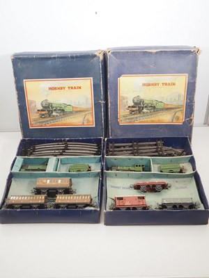 Lot 502 - A pair of HORNBY O gauge clockwork train sets...