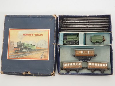 Lot 502 - A pair of HORNBY O gauge clockwork train sets...