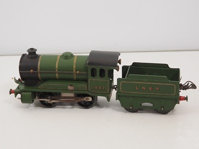 Lot 502 - A pair of HORNBY O gauge clockwork train sets...