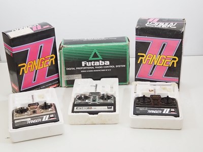 Lot 545 - A group of radio control transmitters in...